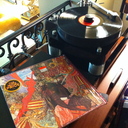 I'm prone to fire up some Rock when I can. The Basis 2800 Signature Series turntable with Basis' Vector arm and Transfiguration Orpheus L cartridge delivered Santana into our room beautifully